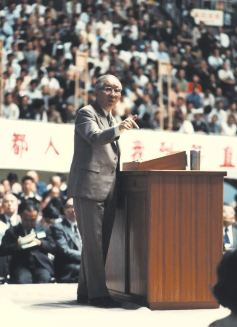 Witness Lee speaking to a large conference audience